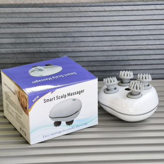 Smart scalp massager with packaging on a striped surface