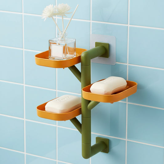 Wall-mounted shelf with three shelves holding soap bars and a small plant on a white background